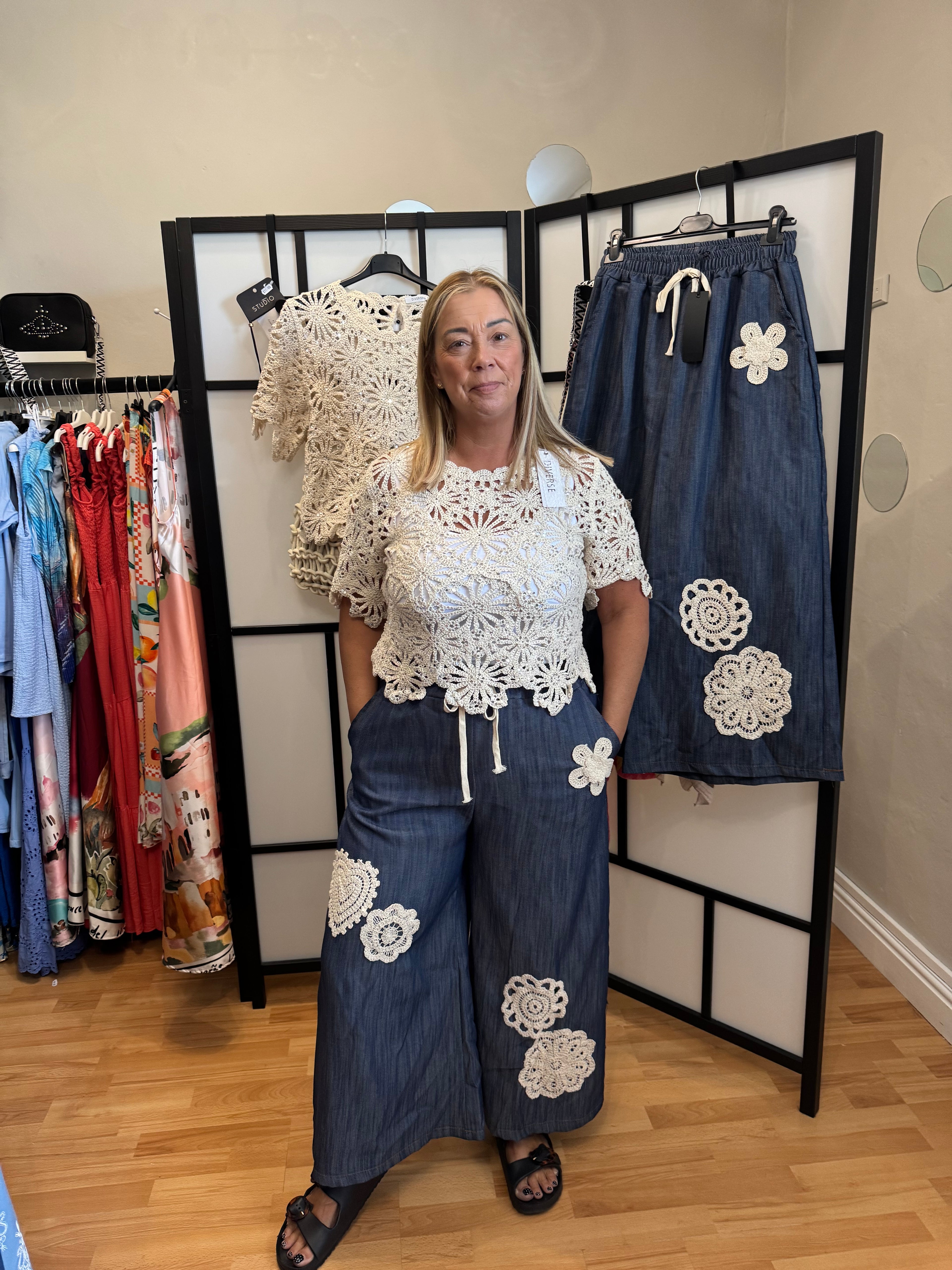Blue denim palazzo trousers with crochet detail