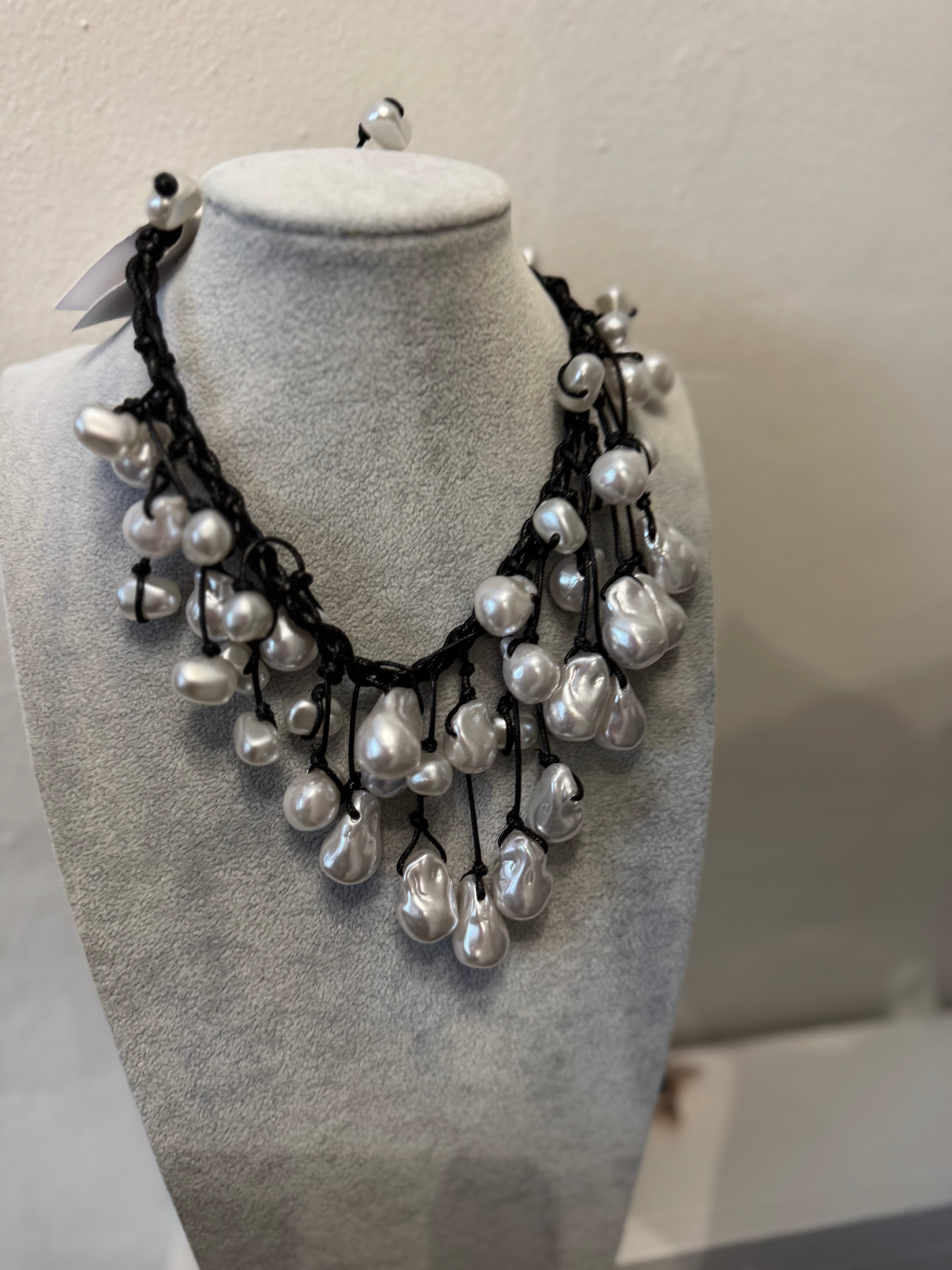 Black faux leather and pearl beaded necklace button fasten